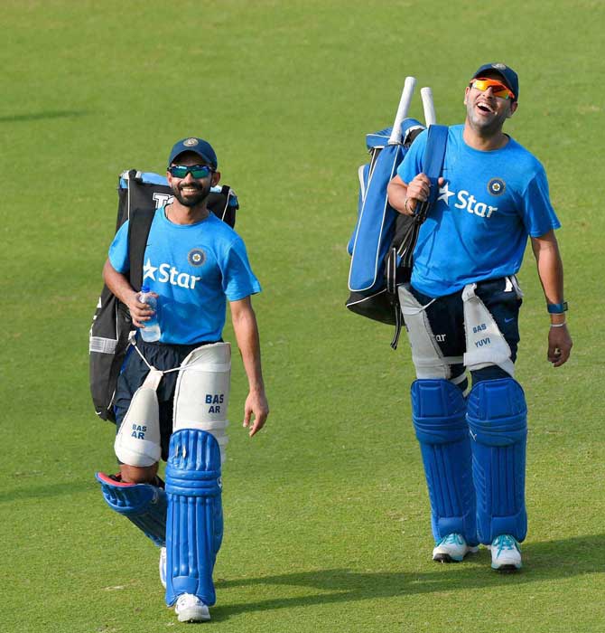Yuvraj Singh and Ajinkya Rahane after a training session n Mohali on Saturday. Pic/PTI