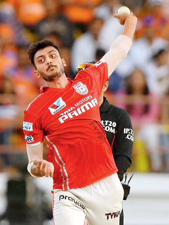 KXIP’s Axar Patel bowls during the IPL match against Gujarat Lions in Rajkot on Sunday. PIC/AFP