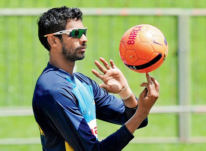 Sri Lankan cricketer Jehan Mubarak plays with a football during a practice session at the Pallekele International Cricket Stadium in July, 2015, ahead of the third Test match against Pakistan. PIC/AFP 