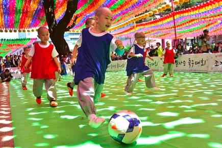 Young South Korean monks play football