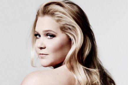 Amy Schumer goes topless for her new book's cover
