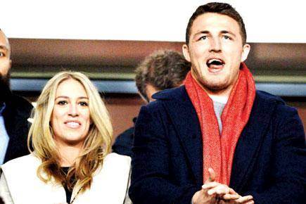 Rugby star slammed for cell phone video while driving with wife