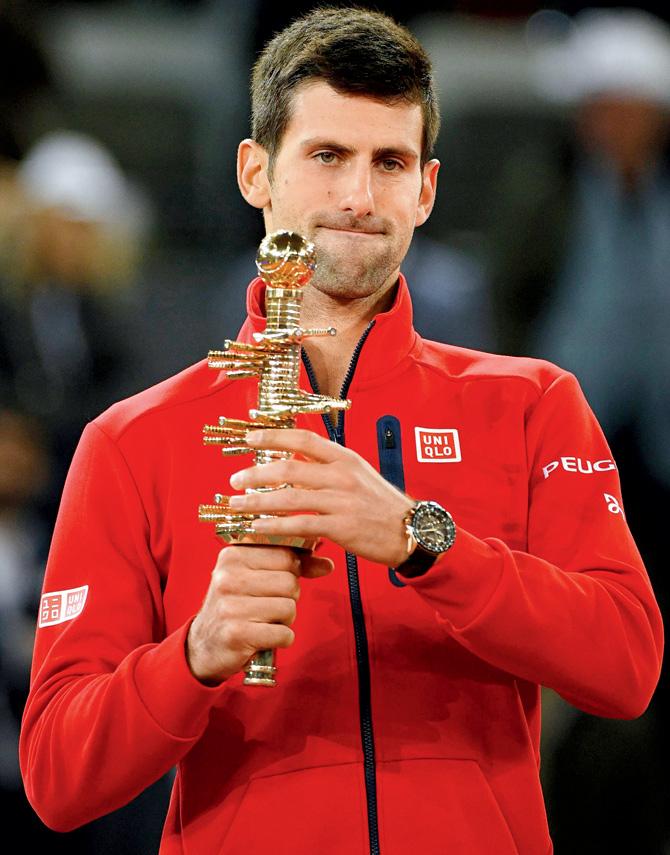 Novak Djokovic with the title after winning the Madrid Open final  on Sunday.