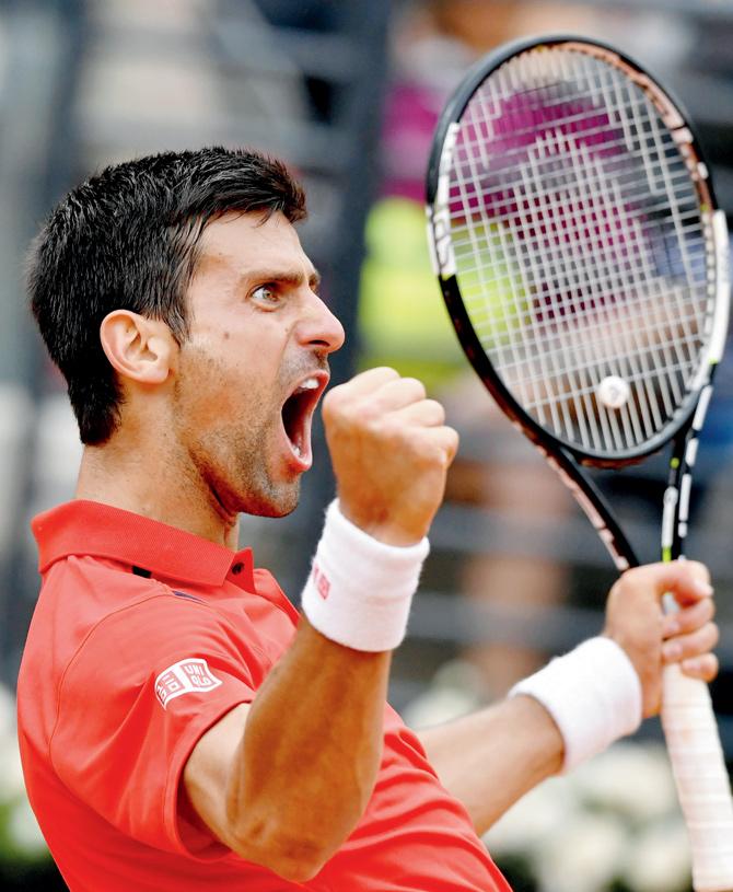 Novak Djokovic reacts after winning a point against Rafael Nadal. Pic/AFP
