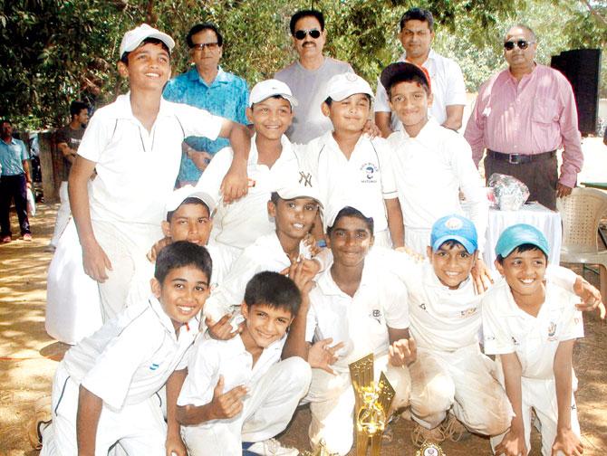 The IDBI Federal Insurance Cup U-12 tournament winners Vengsarkar Foundation Oval team pose along with former India captain Dilip Vengsarkar and Karsan Ghavri (back row, extreme left)