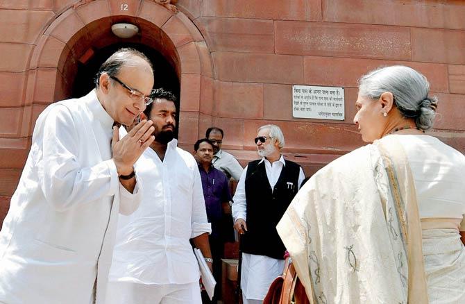 Finance Minister Arun Jaitley (l) greets Rajya Sabha MP Jaya Bachchan (r) during the last day of the Budget session of Parliament in New Delhi on Friday. Pic/PTI