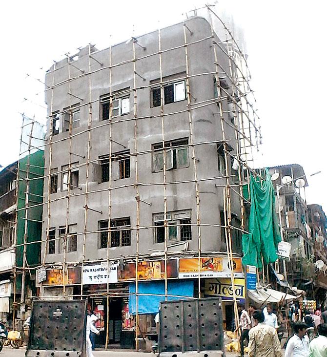 Full-fledged repairs were on at the building on 14th Street, Kamathipura, just three days ago. Pic/MehtabA Quereshi