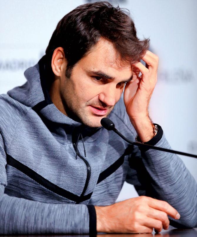 Roger Federer has been plagued by a back injury this year. Pic/AFP