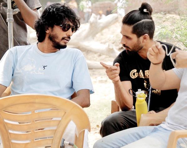 (Right) Chaubey chatting with Shahid Kapur on set
