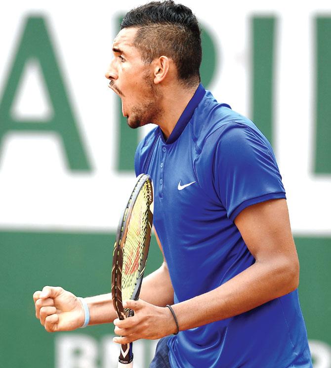 Nick Kyrgios of Australia reacts during his first-round match against Italy