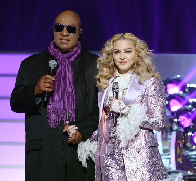 Stevie Wonder and Madonna perform a tribute to Prince onstage during the 2016 Billboard Music Awards