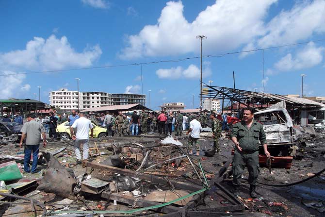 Site of multiple bombings in Syria. Pic/ AFP