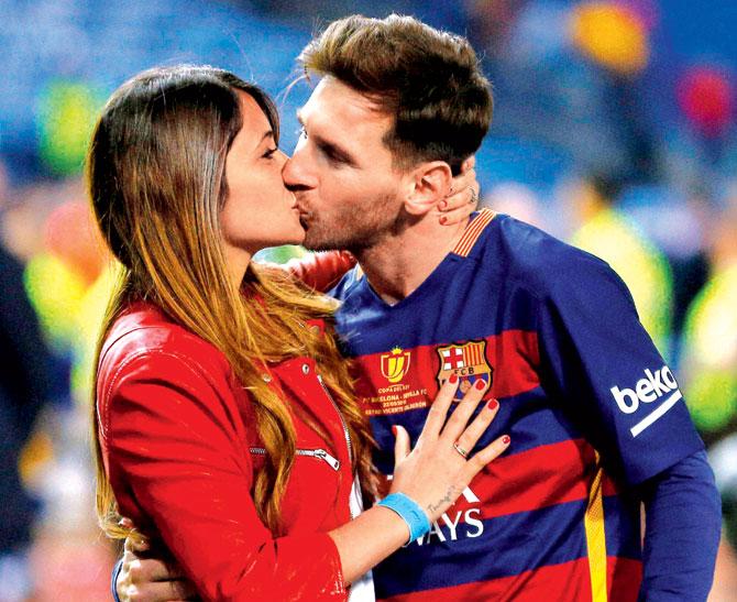 Lionel Messi with partner Antonella Roccuzzo. Pic: AP/PTI