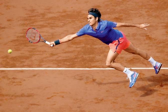 Roger Federer hits a return during the French Open last year at Roland Garros, where he will not play this year due to injury. Pic/AFP