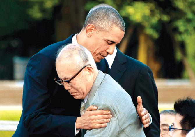 Overwhelmed: US President Barack Obama hugs Shigeaki Mori, a survivor of the 1945 atomic bombing of Hiroshima, during a visit to the Hiroshima Peace Memorial Park yesterday. Pic/AFP