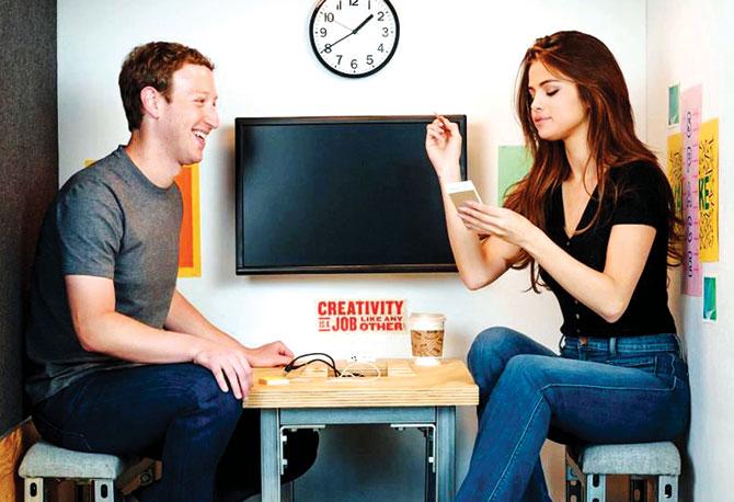 Mark Zuckerberg and Selena Gomez in a similar booth at Facebook HQ in the USA. Pic courtesy/ facebook.com/zuck