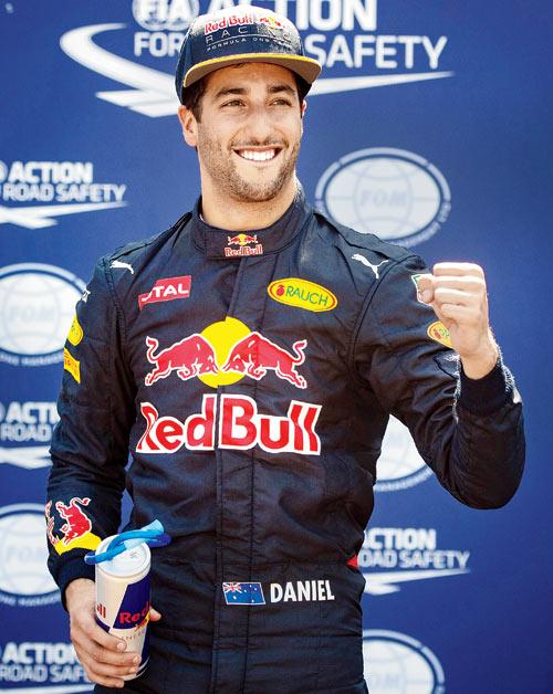 A jubilant Red Bull driver Daniel Ricciardo celebrates his pole position during the Monaco GP Qualifying in Monte Carlo on Saturday. Pic/AFP
