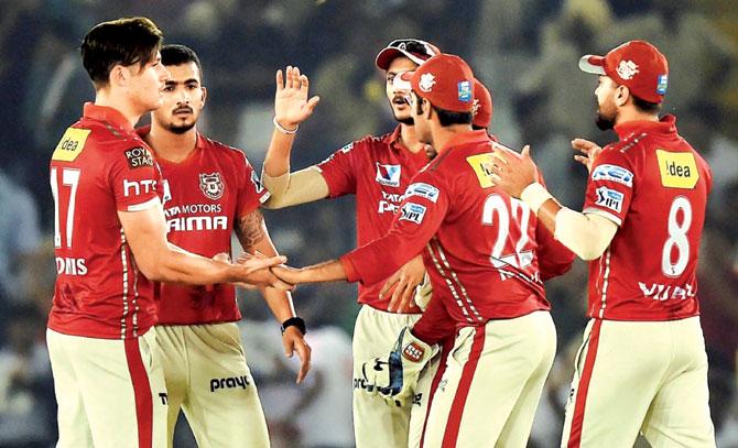 Kings XI Punjab players celebrate the wicket of a Delhi Daredevils batsman during the 2016 Indian Premier League match at the PCA Stadium in Mohali on Saturday. Punjab won by nine runs. Pic/AFP
