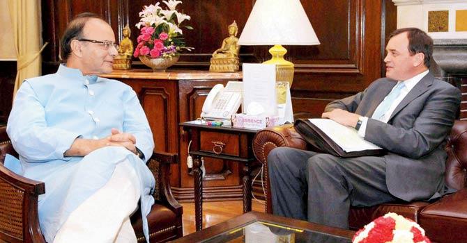 Union Finance Minister Arun Jaitley with British High Commissioner to India, Sir Dominic Asquith at a meeting in New Delhi. Pic/PTI