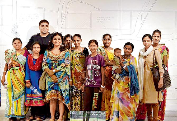 Deepa Nandi (third from left) with Brijesh Arya, founder, Pehchan and a few of Mumbai’s displaced citizens at the Studio X exhibition. Some of them will be present for the walk
