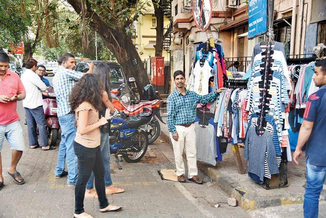 Footpaths taken over by hawkers and overgrown trees, which are seldom trimmed, are two major problems for A Ward residents, like this stretch at Colaba illustrates. Pic/Sameer Markande