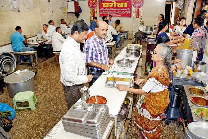 Lunchtime at Gharoba sees a flood of diners, especially office-goers from Parel, who make a dash to the eatery for its veg and non-veg thalis. Pics/Pradeep Dhivar