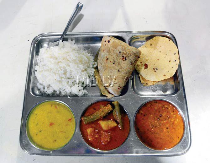 A veg thali at Gharoba includes rice, roti, dal, two side dishes and pickle. It costs Rs 60