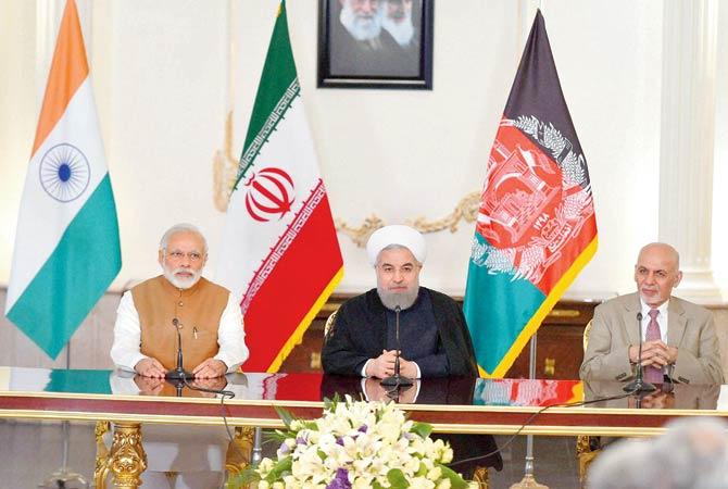 PM Narendra Modi with Iranian President Hassan Rouhani and President of Afghanistan Ashraf Ghani, during a trilateral meeting in Tehran yesterday. Pic/PTI