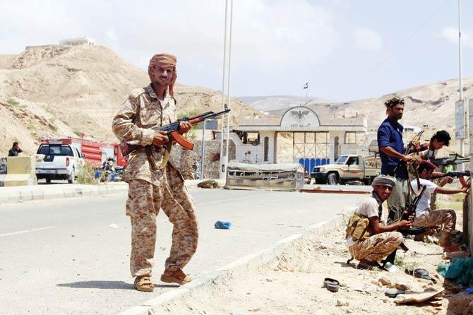 Yemeni soldiers stand guard outside a public security camp Mukalla. Pics/AFP