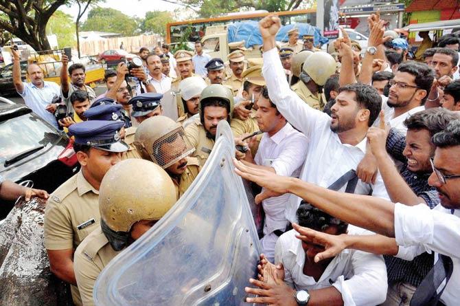 Students and cops clash during a a protest march demanding justice for the murdered law student in Kochi yesterday. Pic/PTI