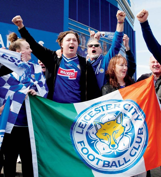 Leicester City fans celebrate their team’s EPL success in Leicester on Thursday. Pic/AFP