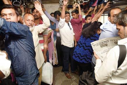 How many people take the Mumbai local trains every day?