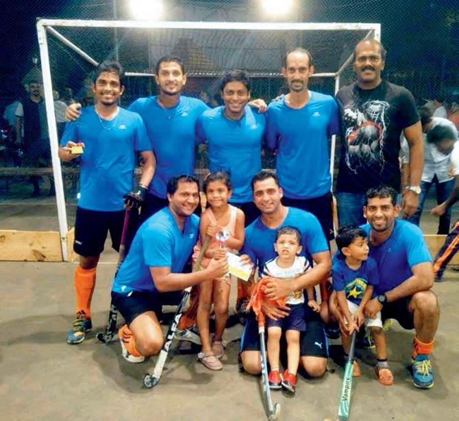 Mumbai Customs’ (standing L to R) Jayesh Jadhav, Joshua Vessaokar, Errol D’Silva, Conroy Remedios, manager Rajesh Salian, (sitting L to R) Stanley Fernandes, Hemant Gethe and Lincoln Taites after winning the Mount Carmel rink hockey title