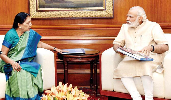 So, what’s cooking? Prime Minister Narendra Modi in a tête-à-tête with Gujarat Chief Minister Anandiben Patel in New Delhi on Monday. PIC/PTI