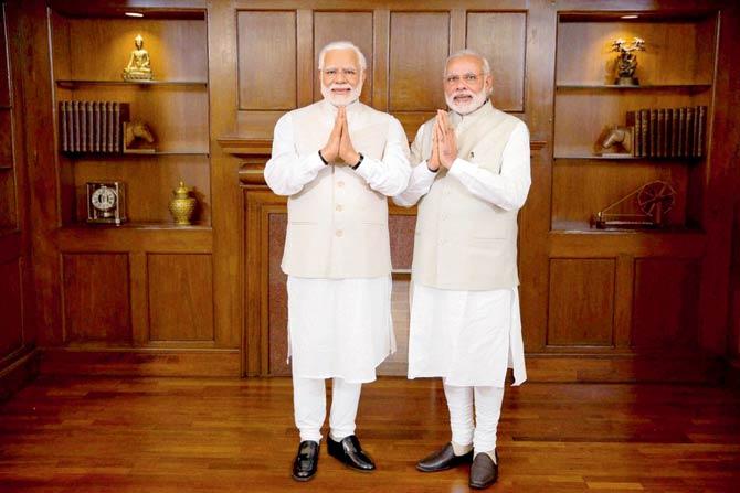 Prime Minister Modi poses with his new wax statue before its installation at the Madame Tussauds museum in London. Pic/PTI
