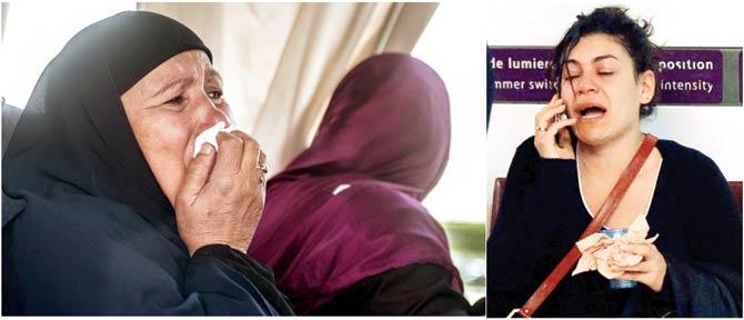 A relative of a passenger cries as family members are transported by bus to a gathering point at Cairo airport yesterday. (Right) A relative of a victim of the EgyptAir flight crash makes a phone call at Charles de Gaulle Airport outside Paris yesterday. Pics/AP & AFP