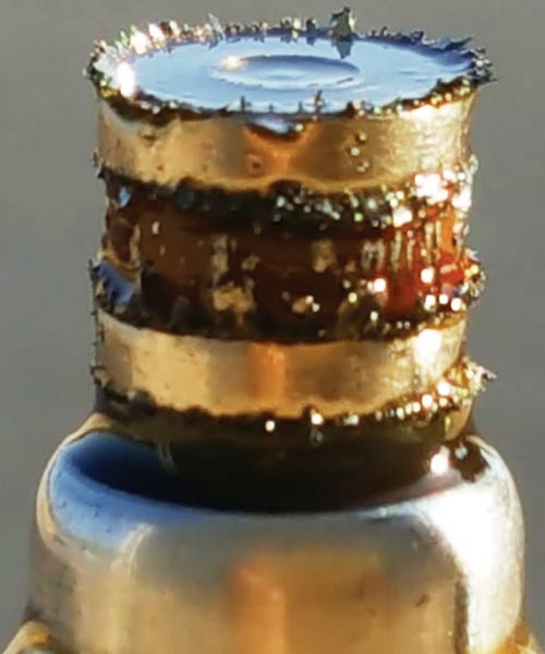 A photo of the magnet plug, after one of the ground tests, with numerous particles attached to it