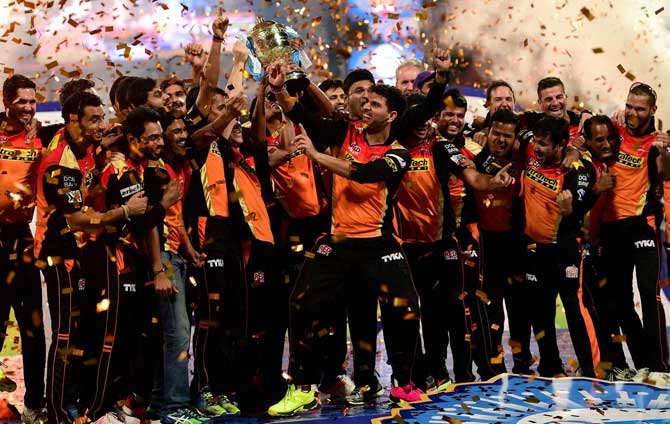 Sunrisers Hyderabad players celebrate with the winning trophy of IPL 2016 after beating Royal Challengers Bangalore in the final match at Chinnaswamy Stadium in Bengaluru on Sunday.
