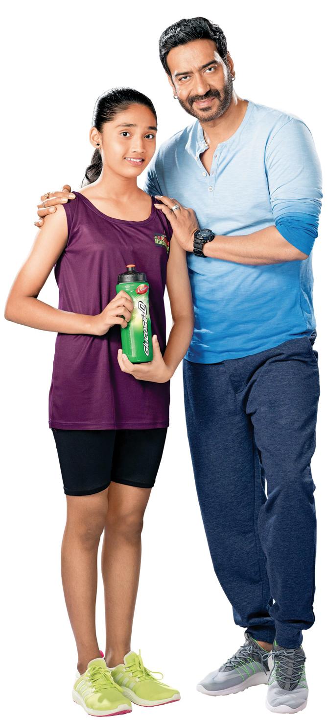 Sayali Mhaishune with Ajay Devgn in a recent advertisement