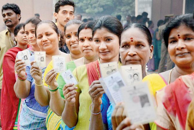 Fundamental right: Women wait in a queue to cast their votes for Assembly polls in Chennai