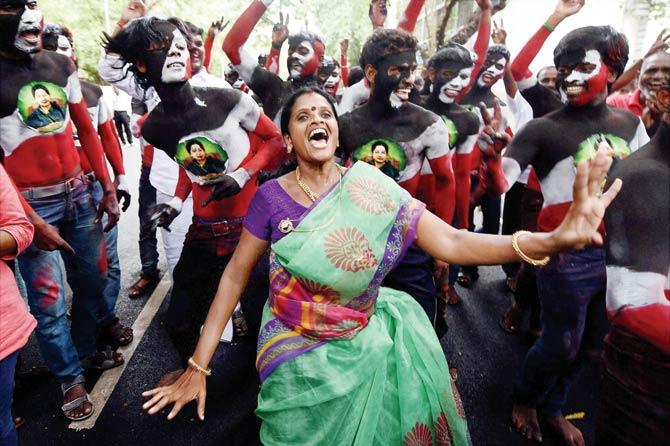 AIADMK supporters celebrate the party’s victory in Chennai yesterday
