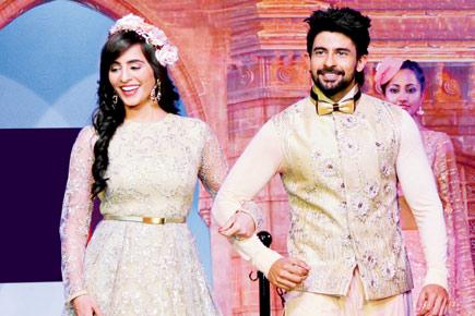 Hussain Kuwajerwala and wife walk the ramp in style