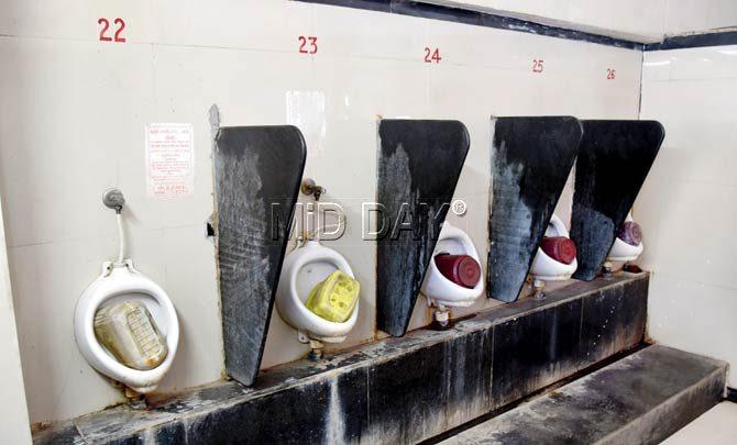 This men’s toilet on Borivali’s platform 6, with jerry cans and buckets upturned into the commodes, is a nightmare for commuters. Pic/Nimesh Dave