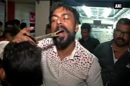 Watch: Varanasi barber cutting hair holding scissors in his mouth