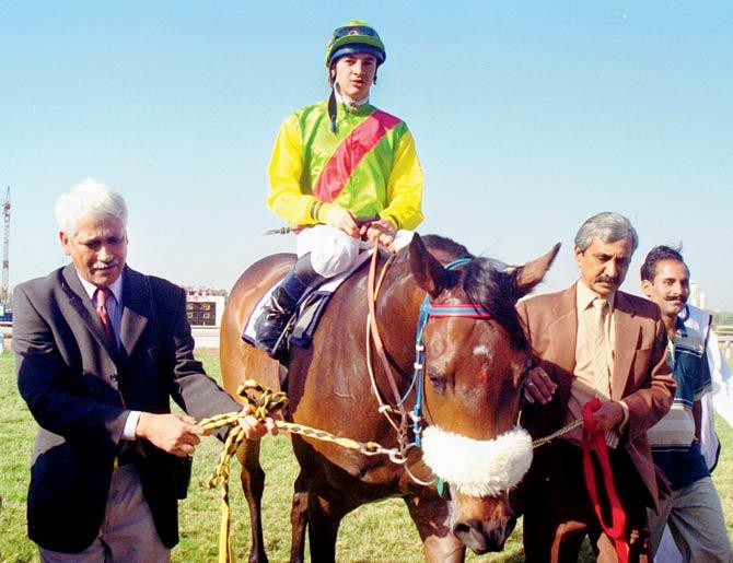 Vijay Shirke (left) with his horse, Noble Eagle, at Mahalaxmi Racecourse