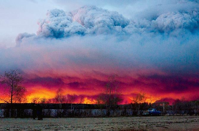 A wildfire moves towards Anzac from Fort McMurray. Pic/AP