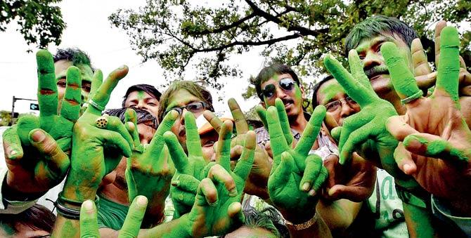 TMC workers celebrate the party’s landslide victory in the West Bengal Assembly elections