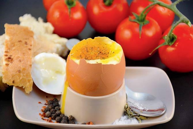 As I wolfed the eggs down (eat it hot, my mother used to say) — the yolks velvety, the whites as slim as the tender lining of a young coconut, the butter intervening with the bits of pepper and salt — I felt strangely good. Pic/Thinkstock