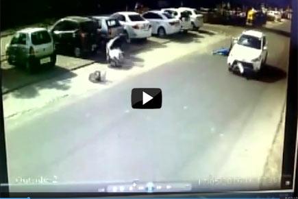 Video: Miraculous escape for two after car dashes into scooter 