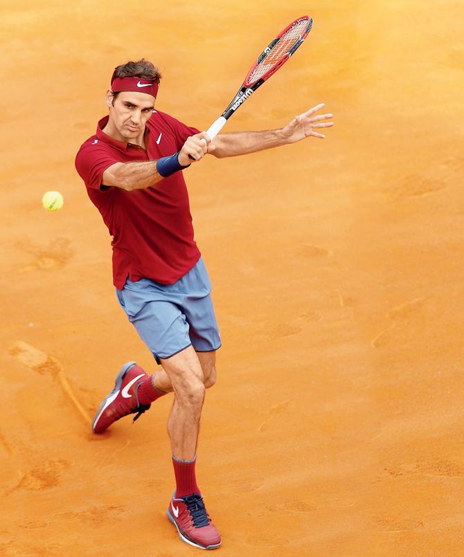 Roger Federer returns during his win over Alexander Zverev of Germany in the second round clash of Rome Masters in Rome yesterday.